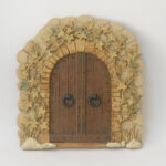 Countryside arched front door sculpture plaque