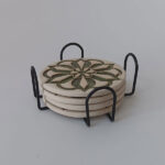 4 Round green coasters in a metal holder
